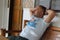 Man relaxing on a veranda on a bamboo sofa