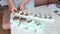 A man removes homemade ice cream on a stick from a silicone mold