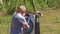 Man Removing Arrows from Target at Archery