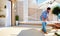 Man renovating rooftop patio zone with open space kitchen