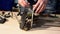 Man repairing broken device in workshop