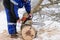 man repairing chainsaw