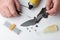 Man repairing a folding knife on white background