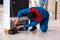 The man repairing fridge with customer