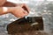 A man repairs a trimmer. A man repairs a lawnmower in close-up