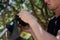 A man repairs a trimmer. A man repairs a lawnmower in close-up