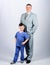 Man respectable businessman and little kid doctor uniform. Doctor respectable career. Dad boss. Father and cute small