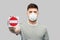 Man in respirator mask showing stop sign