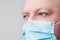 Man in respiratory mask, closeup portrait. Doctor face close up. Influenza, quarantine, coronavirus concept