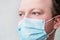 Man in respiratory mask, closeup portrait. Doctors face close up. Influenza, quarantine, coronavirus concept