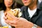 Man in a restaurant eating hamburger