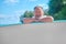 Man resting hands on rowing board looking at camera