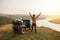 Man rider standing near ATV car. Moto tourism concept