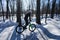 A man rides a bicycle on a pump-track in the winter in a helmet.