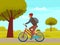 Man rides bicycle on sandy road in forest. Sportsman cycling on background of park landscape