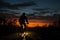 A man rides his bicycle as night descends, a peaceful journey