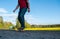 A man rides a longboard in the background of the rural landscape, travel to longborne,