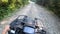 Man rides a quad bike or ATV. POV, view from above.