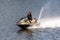 A man rides a red jet ski on the river. Russia, Moscow region, August 2108