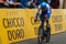 Man riding a bicycle down a lane during a competition