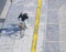 Man riding bicycle on pedestrian pathway in city