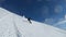 Man riding freeride on snowboard on fluffy powder snow in winter mountain. Snowboarder with avalanche airbag bagpack ride fast on