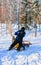 Man riding husky sledge in Lapland in winter Finnish forest reflex