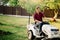 man riding a lawnmower and doing landscaping works