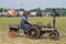 A man riding a mini steam engine