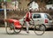 A man riding pedicab on street in Amritsar, India