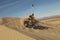 Man Riding Quad Bike In Desert