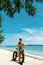 Man Riding Sand Bicycle On Beach. Summer Sport Activity