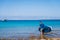 Man riding SUP stand up paddle on vacation