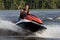 Man riding wave runner in river