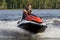 Man riding wave runner in river