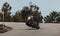 Man riding a Yamaha XSR700 motorcycle in a beautiful road