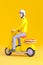 Man riding yellow scooter with pizza on the back. Generative AI