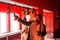 Man rings the bell after the pray inside the hindu temple