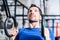 Man at rings doing fitness exercise in gym