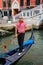 Man rowing gondola in Venice, Italy
