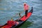 Man rowing gondola in Venice, Italy