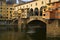 Man rowing shell beneath the Ponte Vecchio