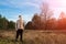 A man in rubber boots is standing in nature. The concept of outdoor recreation