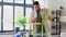 man with ruler measuring old wooden chair at home