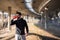 Man Runner Under Bridge in the City drinking water