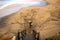 A man running along the sand from the beach stairs to join the surf, coastal Victoria, great ocean road, Australia