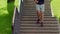 Man running down stairs. Fitness man running downstairs in park