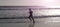 Man running and jumping, banner with copy space. healthy man running on beach. energetic summer. runner feel freedom