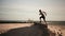 Man running and jumping on the beach