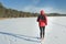 Man running outdoors on snow covering in winter nature